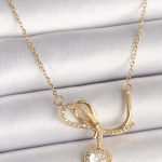 316L Çelik Gold Renk Zincir Zirkon Taşlı Düğüm Sallantı Kalp Model Kadın Kolye