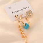 Gold Renk Metal Zirkon Taşlı Yılan ve Kalp Detaylı Küpe Seti