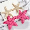 Pirinç Sallantılı Pembe Deniz Yıldızı Model Gold Renk Hasır Küpe