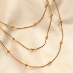 Çelik Altın Renkli Topçuk Tasarımlı Çoklu Kolye